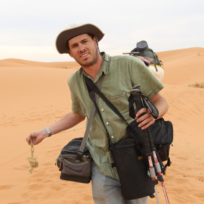 Author / Photographer Ed Darack deep in the interior of the Sahara Desert of North Africa during a photography expedition during which he conducted research on his forthcoming novel series. Copyright Ed Darack; Permission granted for use in media products about / related to Ed Darack's creative work. width=