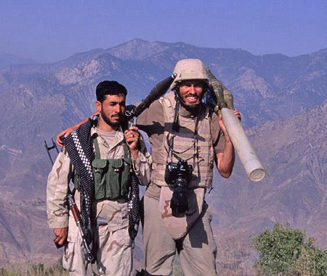 Author / photographer Ed Darack (wearing helmet, with camera) with a member of the Afghan Security Forces attached to U.S. Marines during a combat operation in the Hindu Kush mountains of eastern Afghanistan's Kunar Province. Copyright Ed Darack; Permission granted for use in media products about / related to Ed Darack's creative work. width=