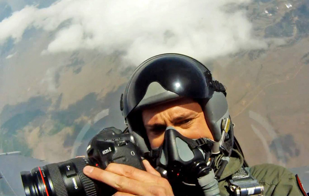 Author / Photographer Ed Darack in the back seat of an F-16D shooting the cover image for Smithsonian's Air & Space magazine, two F-16s pulling vertical over the Rocky Mountains of Colorado. Copyright Ed Darack; Permission granted for use in media products about / related to Ed Darack's creative work. width=