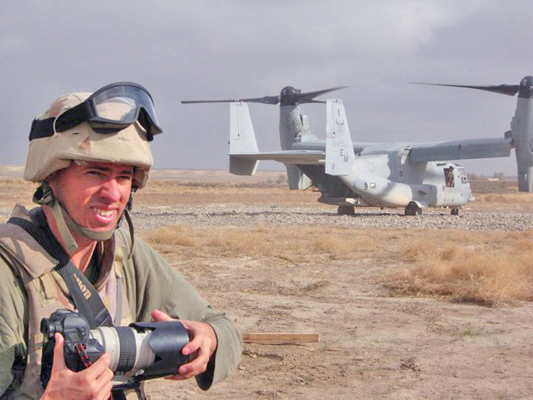 Author / Photographer Ed Darack preparing to board a just-landed Marine Corps MV-22 Osprey at the end of a combat operation on which he embedded in Afghanistan’s southern Helmand Province. Copyright Ed Darack; Permission granted for use in media products about / related to Ed Darack's creative work. width=